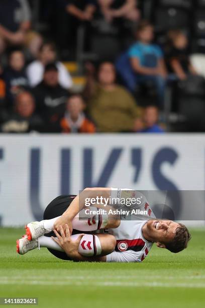 Chris Martin of Bristol City reacts to a tackle during the Sky Bet Championship match between Hull City and Bristol City at MKM Stadium on July 30,...