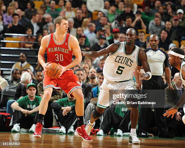 Jon Leuer of the Milwaukee Bucks looks to pass the ball against Kevin Garnett of the Boston Celtics on February 29, 2012 at the TD Garden in Boston,...