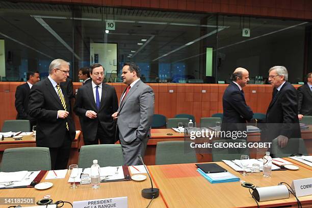 Commissioner for Economic and Monetary Affairs Olli Rehn, European Central Bank president Mario Draghi, Dutch Finance Minister Jan Kees de Jager,...