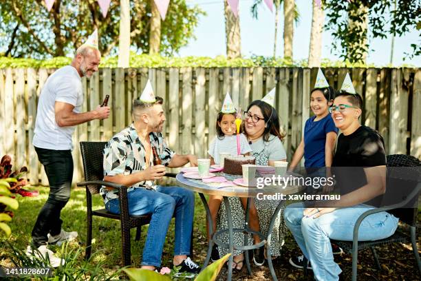 young girl enjoying cake sparkler at birthday party - kid birthday cake stock pictures, royalty-free photos & images