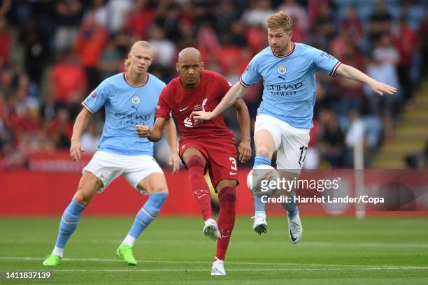 Fabinho of Liverpool is challenged by Erling Haaland and Kevin De Bruyne of Manchester City during the FA Community Shield between Manchester City...