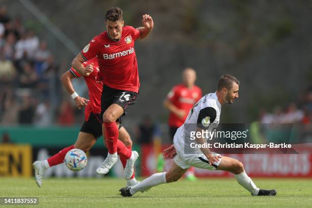 Patrick Schick of Bayer 04 Leverkusen challenges Kevin Conrad of SV 07 Elversberg during the DFB Cup first round match between SV 07 Elversberg and...