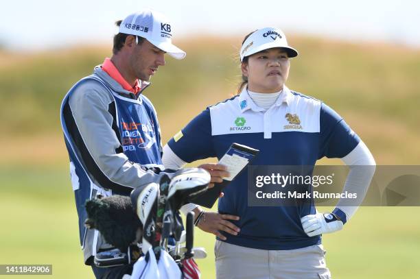 Wichanee Meechai of Thailand prepares to play her second shot at the 18th hole during round three of the Trust Golf Women's Scottish Open at...