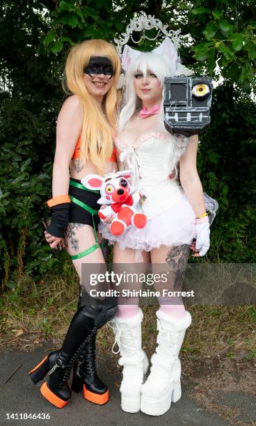 Cosplayers dressed as Katsuki Bakugo and Mangle attend Manchester Comic Con at Bowlers Exhibition Centre on July 30, 2022 in Manchester, England.