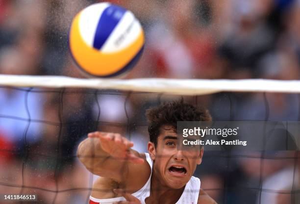 Javier Bello of Team England team mate of Joaquin Bello spikes during their men's preliminary Pool C match against Tuvalu on day two of the...