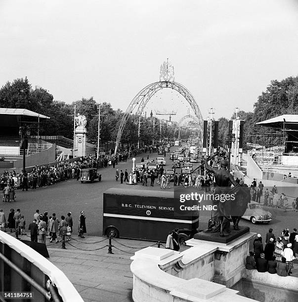 The Coronation of Queen Elizabeth II" -- Pictured: Spectators gather on The Mall outisde of Buckingham Palace during the coronation of Queen...