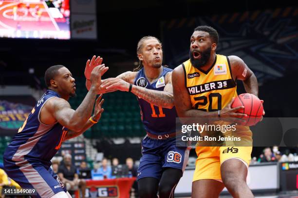 Donte Green of the Killer 3's drives to the basket against Michael Beasley of 3's Company and Mario Chalmers of 3's Company during BIG3 Week Seven at...