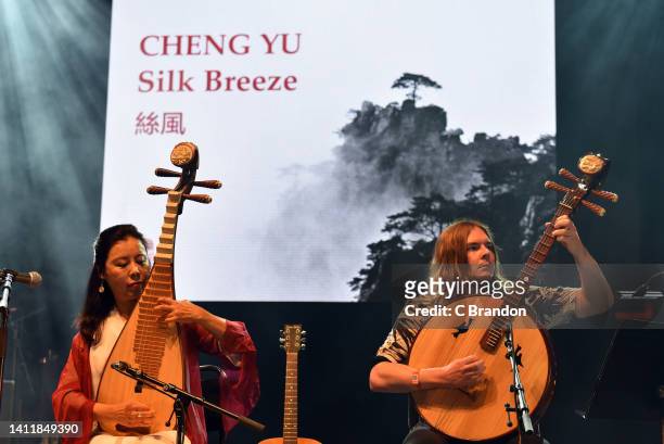 Cheng Yu & Silk Breeze perform on stage during the 40th Anniversary of the Womad Festival at Charlton Park on July 30, 2022 in Malmesbury, England.