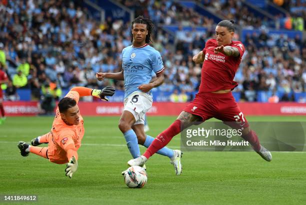 Darwin Nunez of Liverpool is challenged by Ederson and Nathan Ake of Manchester City during The FA Community Shield between Manchester City and...