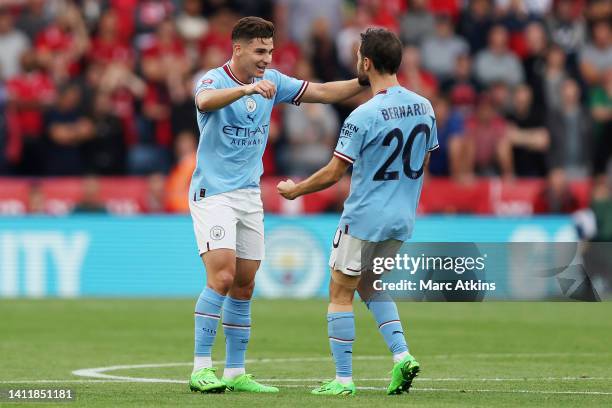 Julian Alvarez of Manchester City celebrates with teammate Bernardo Silva after scoring the first goal of their team during The FA Community Shield...