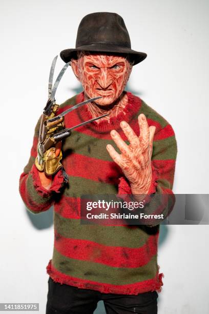 Cosplayer dressed as Freddy Krueger attends Manchester Comic Con at Bowlers Exhibition Centre on July 30, 2022 in Manchester, England.