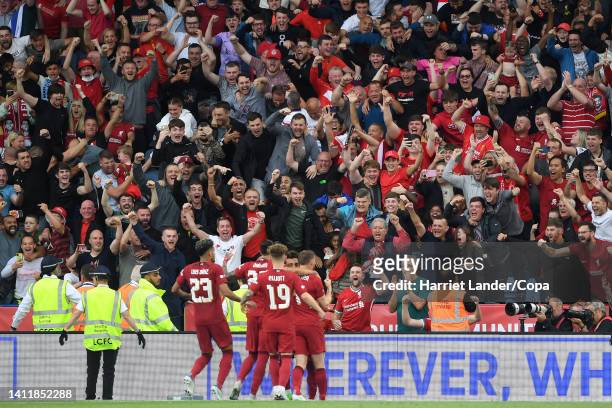 Mohamed Salah of Liverpool celebrates in front of the fans and with his teammates after scoring his team's second goal during the FA Community Shield...