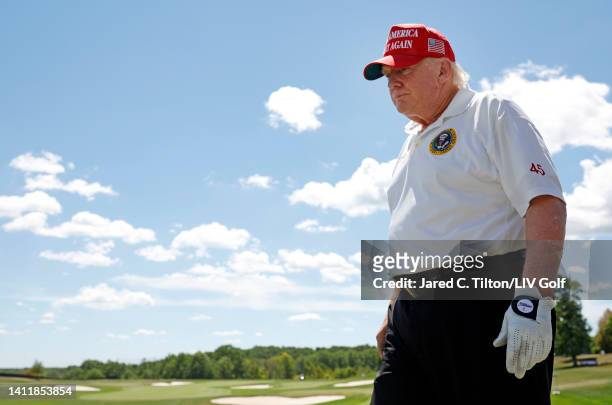 Former U.S. President Donald Trump walks the driving range during day two of the LIV Golf Invitational - Bedminster at Trump National Golf Club...