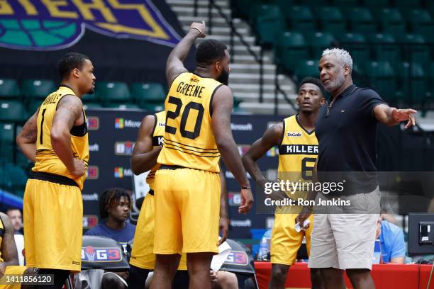 Head coach Charles Oakley of the Killer 3's talks with Donte Green of the Killer 3's during a game against 3's Company during BIG3 Week Seven at...