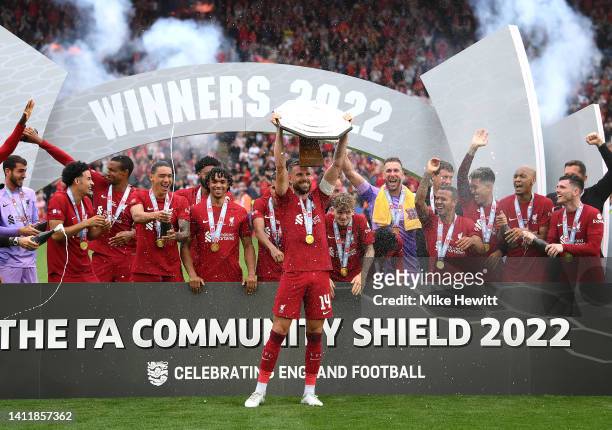 Jordan Henderson of Liverpool, lifts The FA Community Shield following victory during The FA Community Shield between Manchester City and Liverpool...