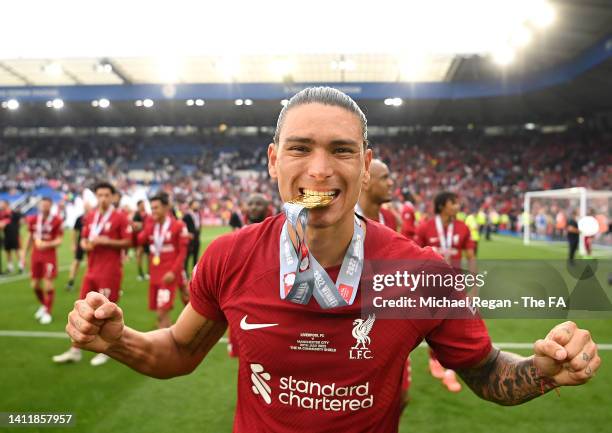 Darwin Nunez of Liverpool bites their winners medal after the final whistle of The FA Community Shield between Manchester City and Liverpool FC at...