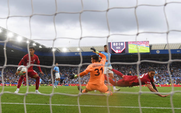 Darwin Nunez of Liverpool scores the third goal of his team past Ederson of Manchester City during The FA Community Shield between Manchester City...