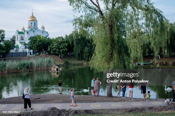 One of the lakes in the city center is a popular place among locals to feed swans and enjoy a peaceful setting on July 30, 2022 in Tiraspol, Moldova....