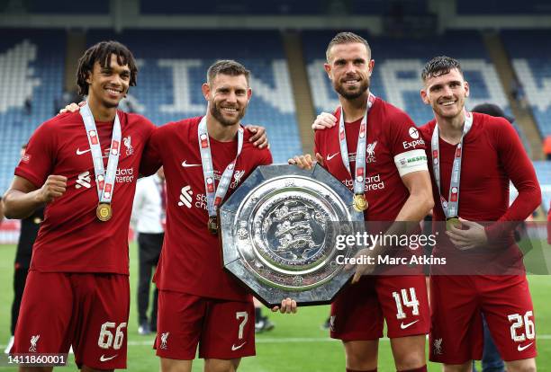 Trent Alexander-Arnold, James Milner, Jordan Henderson and Andrew Robertson of Liverpool celebrate with the FA Community Shield following victory...