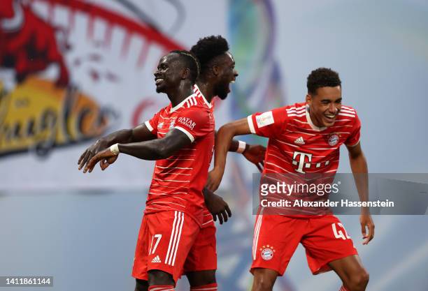Jamal Musiala of Bayern Munich celebrates scoring their side's first goal with teammates Alphonso Davies and Sadio Mane during the Supercup 2022...