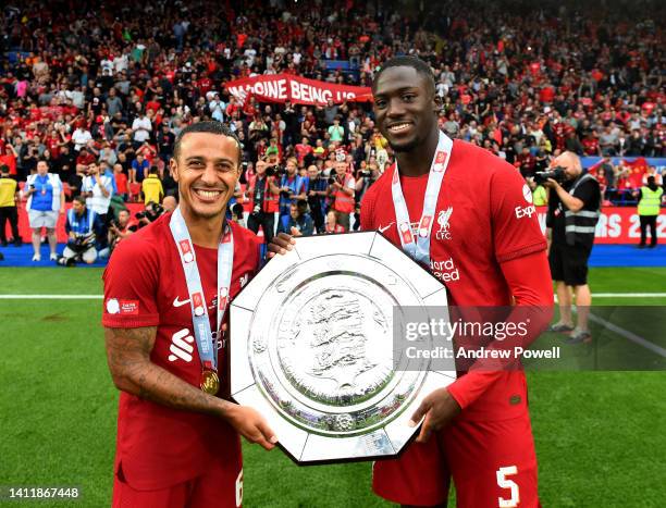 Thiago Alcantara and l0 with the FA Community Shield trophy at the end of the FA Community Shield match between Manchester City and Liverpool at The...