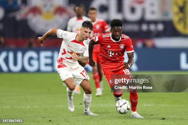 Dominik Szoboszlai of RB Leipzig marks Alphonso Davies of Bayern Munich during the Supercup 2022 match between RB Leipzig and FC Bayern München at...