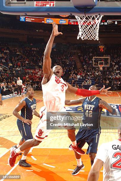 God'sgift Achiuwa of the St. John's Red Storm drives to the basket during a first round game of the against the Pittsburgh Panthers at the 2012 Big...