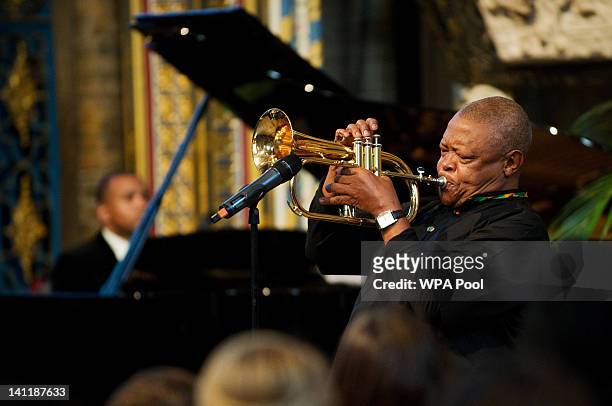 South African musician Hugh Masekela performs during the annual Commonwealth Day Observance Service at Westminster Abbey on March 12, 2012 in London,...