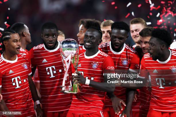 Sadio Mane of Bayern Munich celebrates with the Supercup trophy after the final whistle of the Supercup 2022 match between RB Leipzig and FC Bayern...