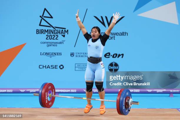 Bindyarani Devi Sorokhaibam of Team India reacts after performing a clean & jerk during Women's Weightlifting 55kg Final on day two of the Birmingham...