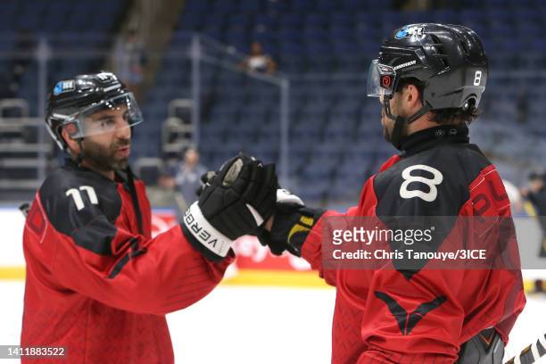 Samson Mahbod of Team Carbonneau shakes hands with Aaron Palushaj after defeating Team Trottier 5-3 during 3ICE Week Seven at Videotron Centre on...