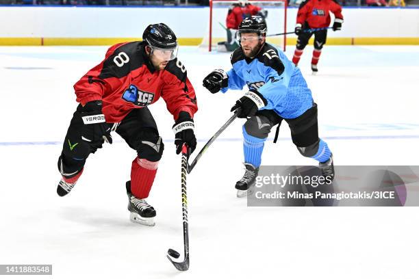 Aaron Palushaj of Team Carbonneau carries the puck against Chad Costello of Team Trottier during 3ICE Week Seven at Videotron Centre on July 30, 2022...