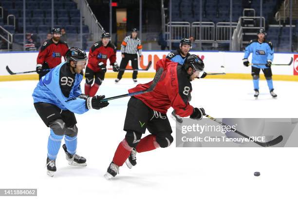 Matt Salhany of Team Trottier defends against Aaron Palushaj of Team Carbonneau during 3ICE Week Seven at Videotron Centre on July 30, 2022 in Quebec...