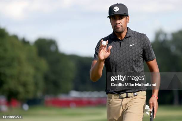 Tony Finau of the United States reacts after making birdie on the 17th green during the third round of the Rocket Mortgage Classic at Detroit Golf...