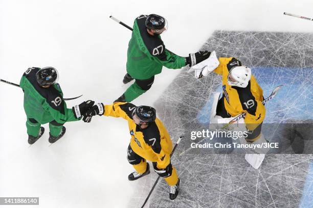 Chris Mueller and John Schiavo of Team Murphy shake hands with Patrick Mullen and Jacob Theut of Team Mullen after winning 7-4 during 3ICE Week Seven...