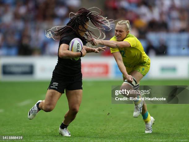 Maddison Levi of Team Australia pulls the hair of Portia Woodman of Team New Zealand during the Women's Rugby Sevens Semi-Final match between Team...