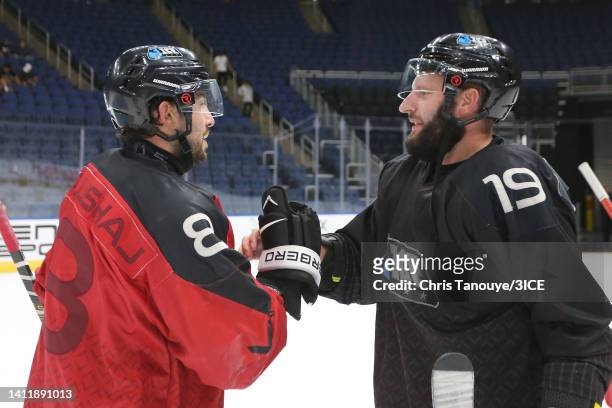 Aaron Palushaj of Team Carbonneau shakes hands with Jack Combs of Team LeClair after winning the semifinal game 8-2 during 3ICE Week Seven at...