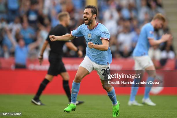 Bernardo Silva of Manchester City celebrates after Julian Alvarez of Manchester City has his goal, Manchester City's first, confirmed after a VAR...