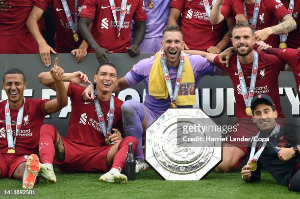 Thiago, Darwin Nunez, Adrian, Jordan Henderson, and Kostas Tsimikas of Liverpool celebrate with the FA Community shield following their victory in...