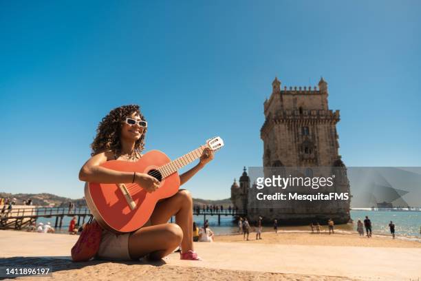 tourist playing guitar in portugal - traditionally portuguese stock pictures, royalty-free photos & images