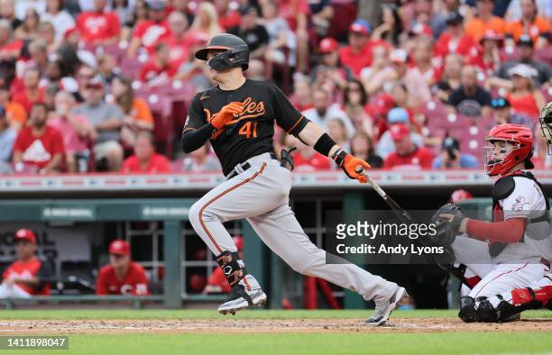 Tyler Nevin hits a single in the second inning of the Baltimore Orioles against the Cincinnati Reds at Great American Ball Park on July 30, 2022 in...