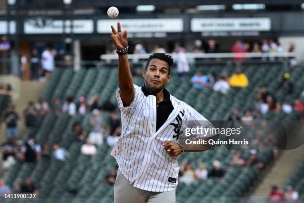 Charlie Miñoso, son of the late Hall of Famer Minnie Miñoso, throws a ceremonial first pitch before the game between the Chicago White Sox and the...