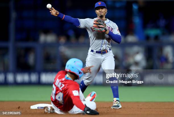 Francisco Lindor of the New York Mets throws to first base during the fifth inning against the Miami Marlins at loanDepot park on July 30, 2022 in...