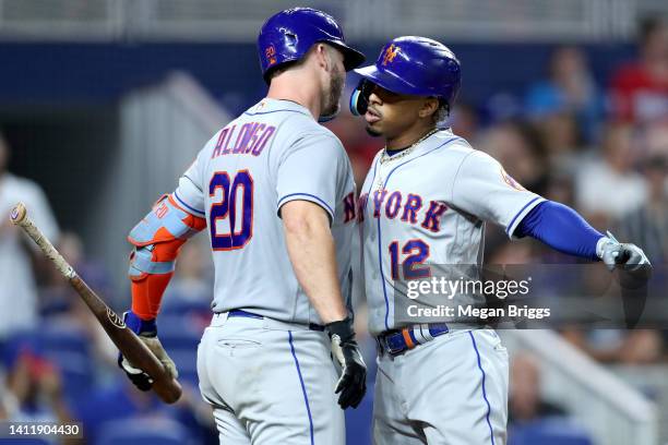 Francisco Lindor of the New York Mets celebrates his home run with Pete Alonso of the New York Mets during the eighth inning against the Miami...