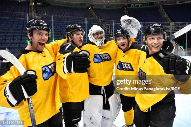 Jacob Theut of Team Mullen celebrates with teammates after defeating Team Carbonneau 5-2 in the final during 3ICE Week Seven at Videotron Centre on...