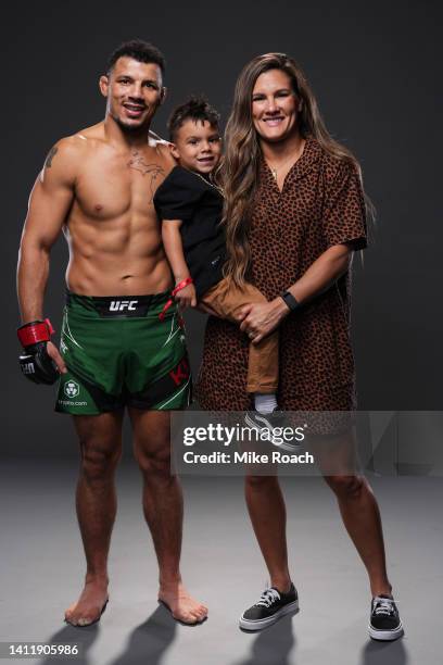 Drakkar Klose poses with Cortney Casey and their son King for a post fight portrait backstage during the UFC 277 event at American Airlines Center on...