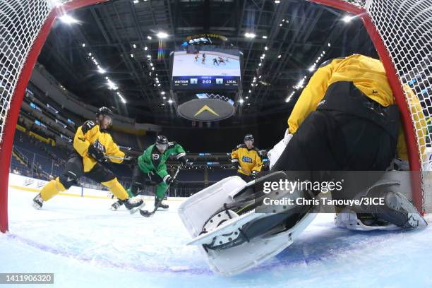 Chris Mueller of Team Murphy shoots against Jacob Theut of Team Mullen in the semifinal game during 3ICE Week Seven at Videotron Centre on July 30,...