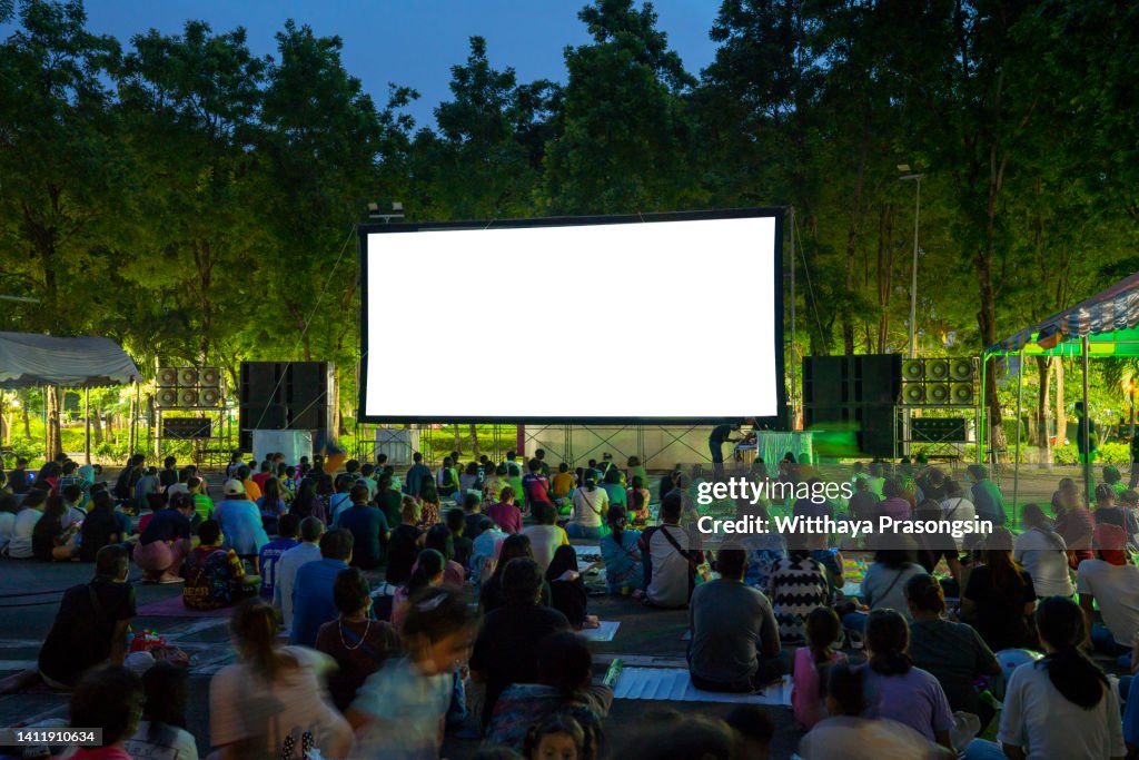 Spectators at Open-Air cinema summer night