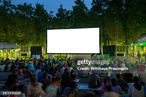 Spectators at Open-Air cinema summer night Spectators at Open-Air cinema summer night