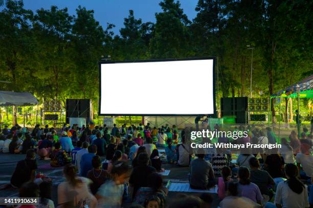 spectators at open-air cinema summer night - movies bildbanksfoton och bilder